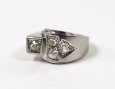 A continental 750 white metal and four stone diamond set dress ring, size H, gross weight 6.1