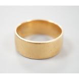 A yellow metal wedding band, unmarked, size P, 7.4 grams.