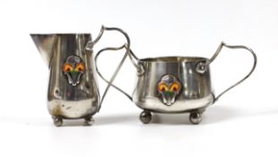 An Edwardian Art Nouveau silver and enamelled cream jug and sugar bowl, C & Co, Birmingham, 1905,