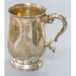 A George V silver baluster mug, Birmingham, 1934, 13.5cm, 14oz.