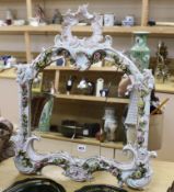 A German Dresden-style ornamental porcelain easel mirror, 70cm tall
