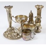 Assorted silver ware including a pair of George V spill vases, a small vase, a two handled trophy