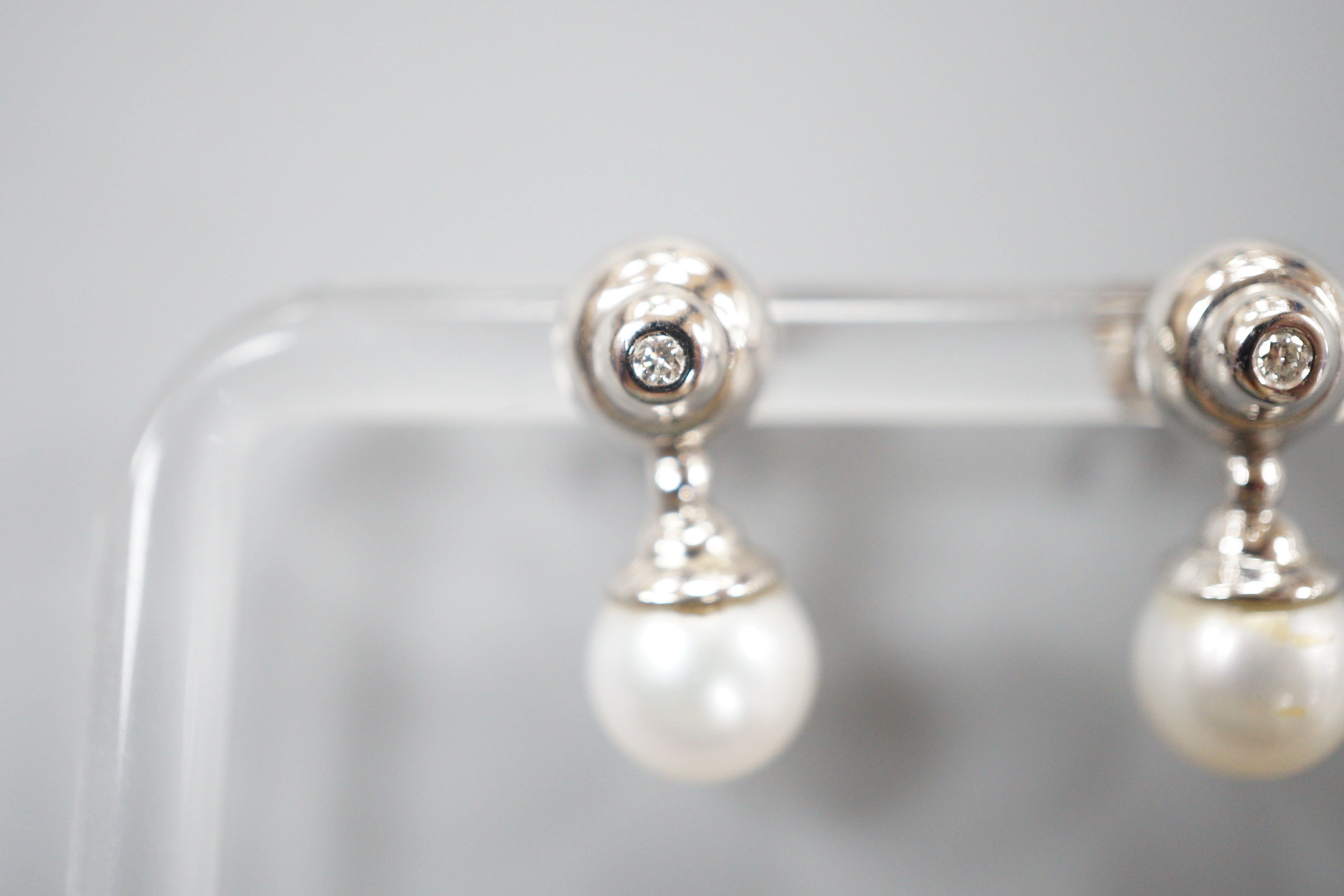 A modern pair of 198ct white gold cultured pearl and single stone collet set diamond ear studs, - Image 2 of 4