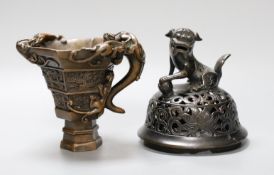 A Chinese bronze handled libation cup, together and a bronze cover with pierced decoration and