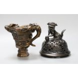 A Chinese bronze handled libation cup, together and a bronze cover with pierced decoration and