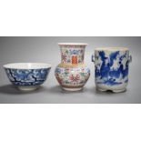 An early 20th century Chinese famille rose vase, a Chinese blue and white jar, lacking cover and a