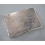 A George V engine turned silver rectangular cigarette box, Mappin & Webb, London, 1933, 12.8cm.