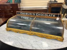 An early 20th century parcel gilt mahogany Cadbury's Chocolate table top shop display cabinet