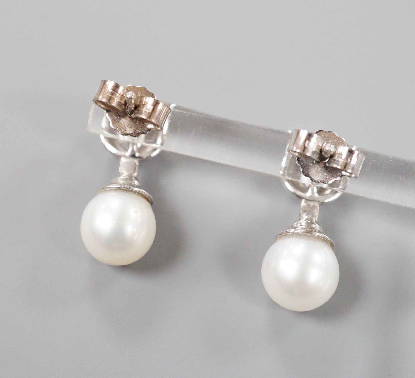 A modern pair of 198ct white gold cultured pearl and single stone collet set diamond ear studs, - Image 4 of 4