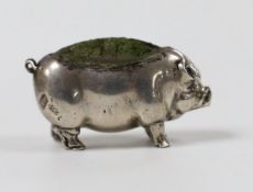 An Edwardian novelty silver mounted pin cushion, modelled as a pig, Levi & Salaman, Birmingham,