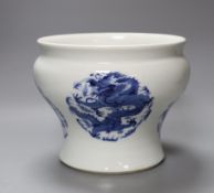 A Chinese under-glazed blue and white dragon bowl, 18cm tall