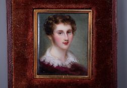 J. Roth, a gold framed enamelled miniature portrait of a gentleman with lace collar, signed 3.5 x