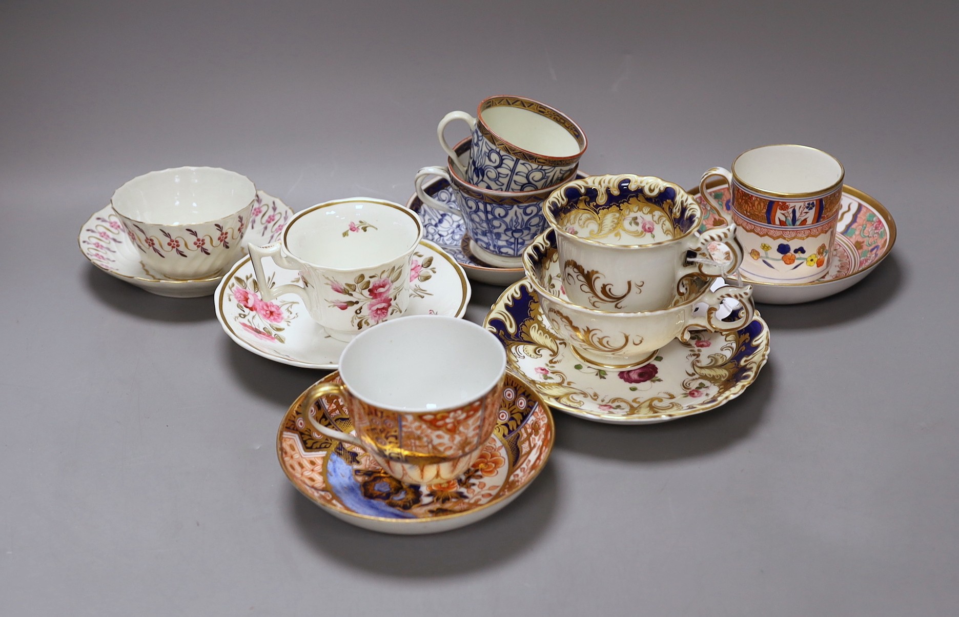 A Spode Imari pattern coffee can and saucer, a Coalport Imari cup and saucer, a Coalport style
