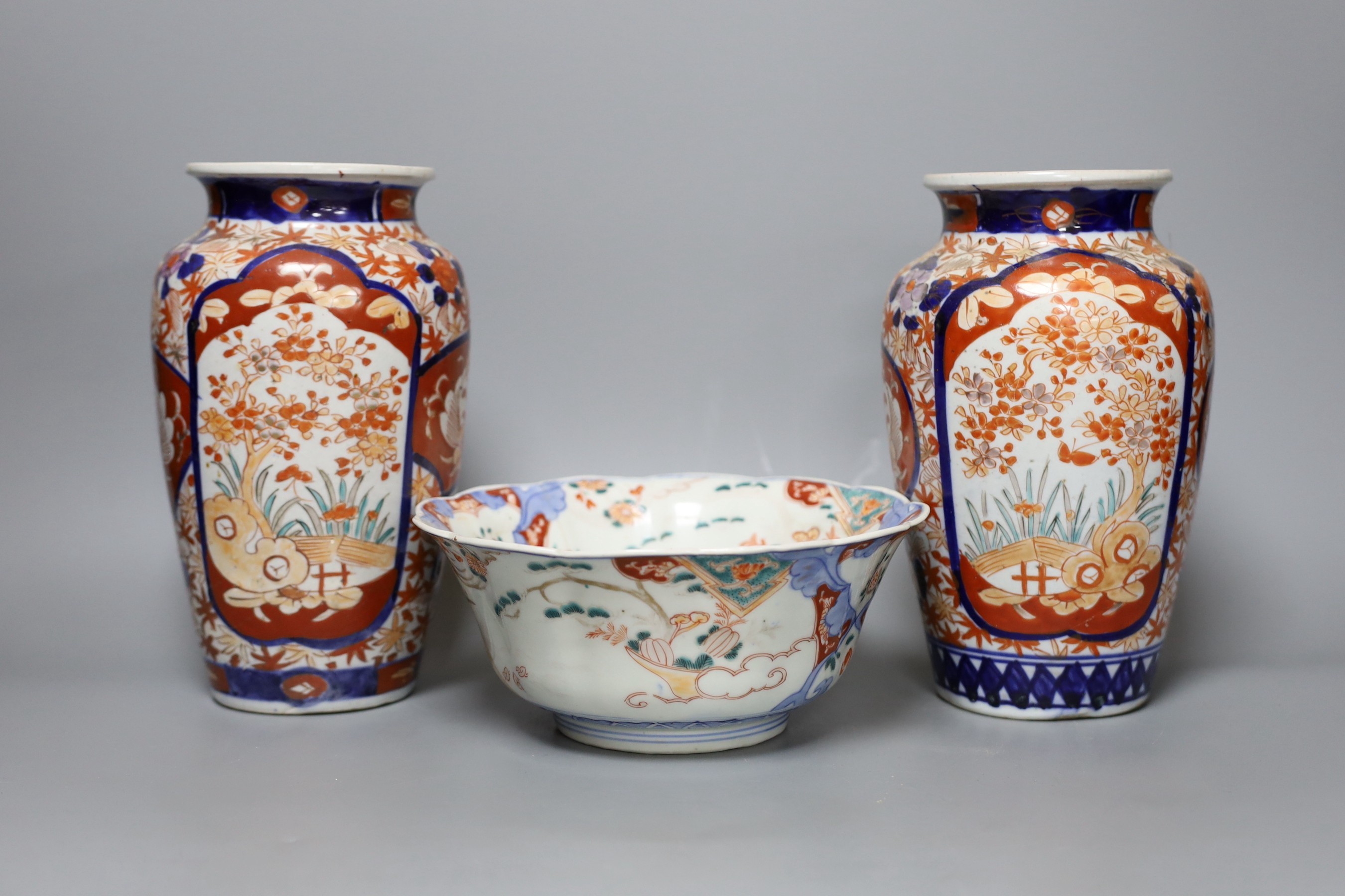 A 19th century Imari lobed dish and a pair of Imari vases, tallest 21cm