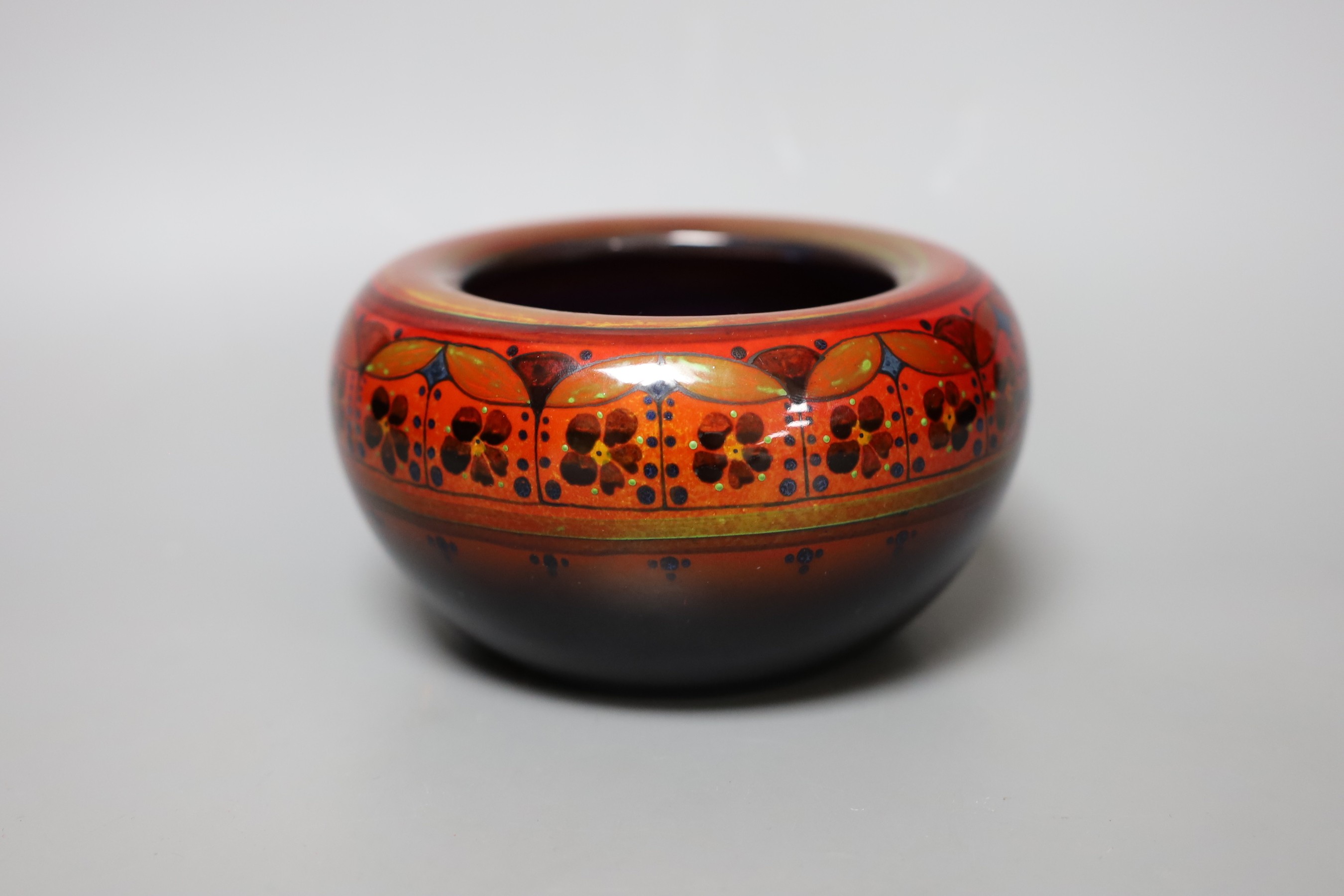 A Doulton Flambé Sung bowl with floral motif, 9cm tall