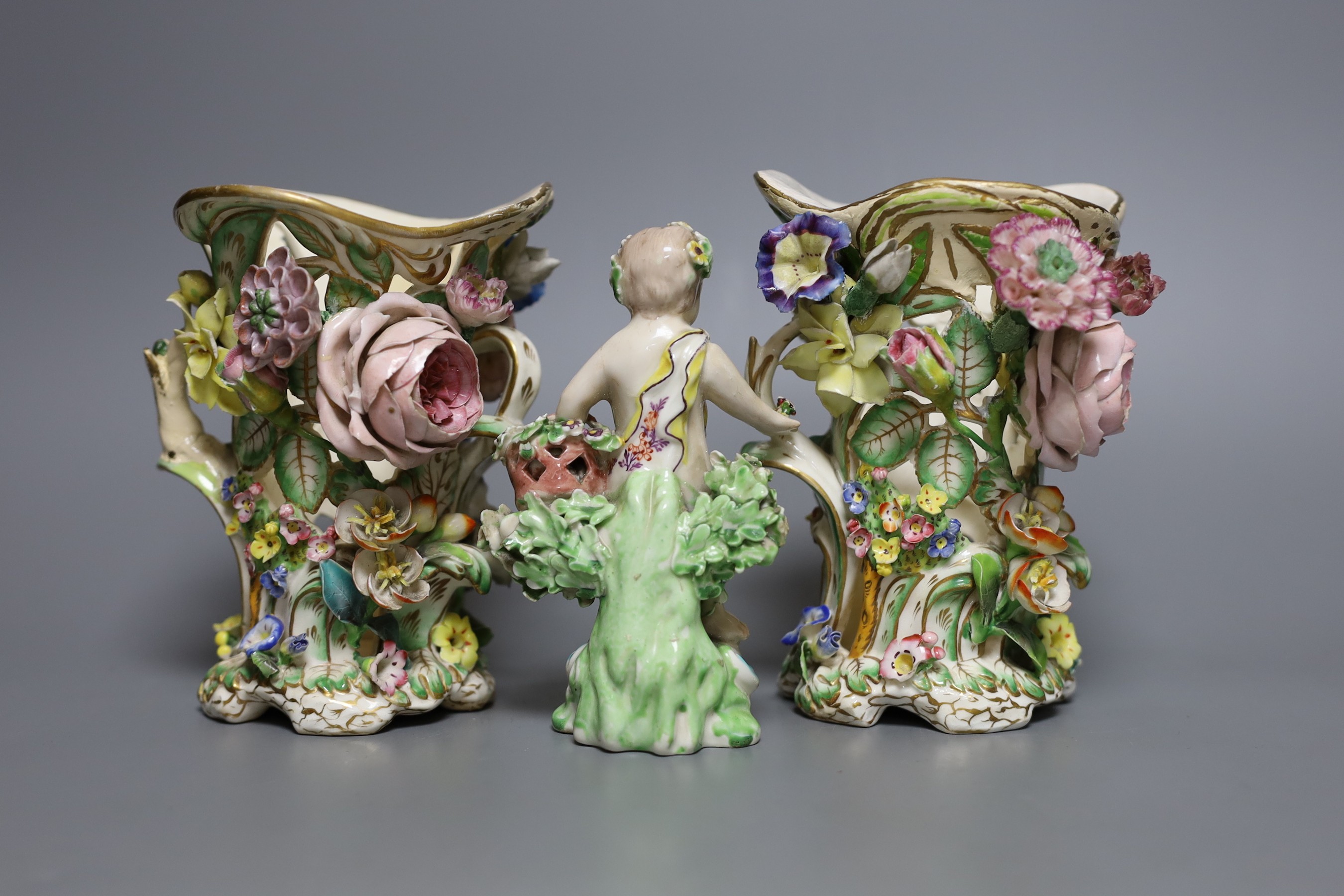 A 19th century Derby figure of a putti with flowers together with two floral encrusted porcelain - Image 2 of 3