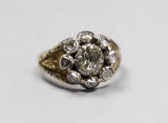 An early 19th century gold overlay and silver, rose diamond cluster ring, size P, gross 6.3 grams