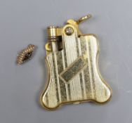 A Russian enamelled and seed pearl set brooch initialled KAOT, 1.75cm, gross 2.5 grams and a gold