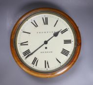 A Victorian mahogany cased eight day circular dial wall timepiece by John Thompson of Hexham, 38cm