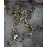 A pair of gilt metal twin branch lustre wall lights and a set of four gilt metal twin branch wall