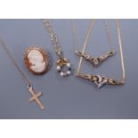 A 9ct gold diamond chip set necklace and matching bracelet, a cross pendant, a sapphire diamond