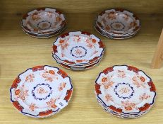 Eight early 19th century English 'Stone China' circular plates with cream, red and white