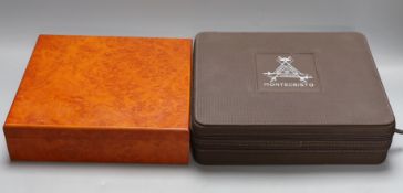 A Montecristo cigar humidor and another faux walnut humidor