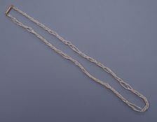 A Victorian triple strand seed pearl necklace, with gold clasp, 42cm