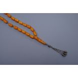 An early 20th century reconstituted amber bead necklace, gross 26.5 grams