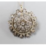 A late Victorian gold silver and diamond circular cluster pendant brooch, 3.5cm, gross 17.5 grams