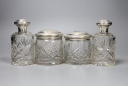 A pair of Continental white metal mounted cut glass scent bottles, 12.5cm and two matching toilet