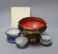 A collection of Chinese blue and white tea bowls, a vase, metal planter and book on Hong Kong by