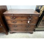 A Georgian mahogany straight front chest, fitted four graduated drawers and a slide, caddy top,