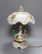 A continental porcelain figural lamp with lithophane shade, 40cm