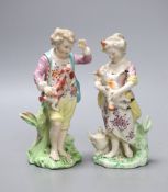A pair of Chelsea Derby figures of a boy and a girl, she with a lamb and he with a dog, c.1775, 14.
