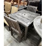 A square weathered teak garden table, width 80cm, height 73cm together with two teak garden chairs