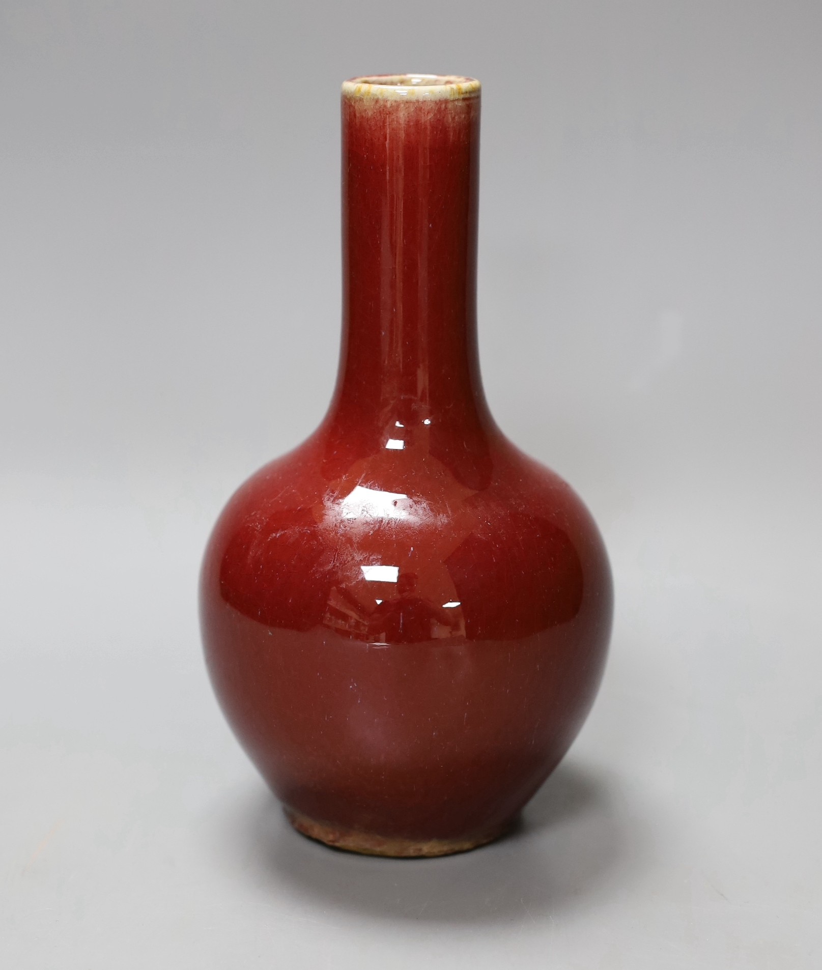 A small Chinese sang de boeuf bottle vase, 18cm tall