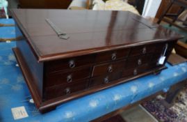 An Indonesian hardwood hinged top 12-drawer coffee table/storage chest, width 118cm, depth 66cm,