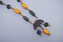 A 1930's gilt brass mounted composition and simulated amber bead necklace, 40cm