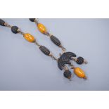 A 1930's gilt brass mounted composition and simulated amber bead necklace, 40cm