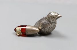 An Edwardian silver mounted ruby glass scent bottle, 4cm and a silver overlaid bird paperweight,