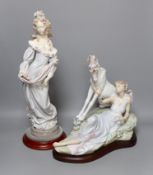 A Lladro figure of a lady and a similar figure group of a lady and a unicorn. Both on hardwood