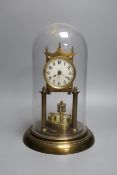 A German 400 day brass mantel timepiece, under a glass dome, 30cm total