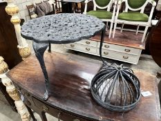 A circular aluminium low garden table, diameter 63cm, height 43cm together with four planter frames