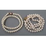 Two single strand cultured pearl necklaces, one possibly freshwater pearl?, both with 9ct gold