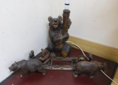 A group of Black Forest carved wood bears: a lamp, a book rack, etc.