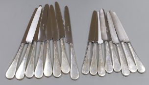 A set of sixteen silver-handled table knives, London 1995