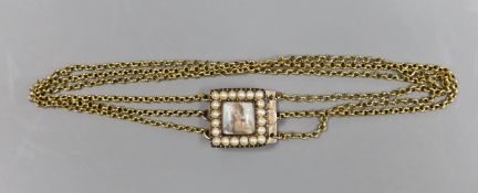 An early 19th century seed pearl set gold bracelet clasp, inset with a miniature of a lady, 1.5cm,