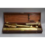 A cased set brass microscope