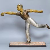 An Art Deco style bronzed and silvered spelter figure of a boule player, on marble plinth, height